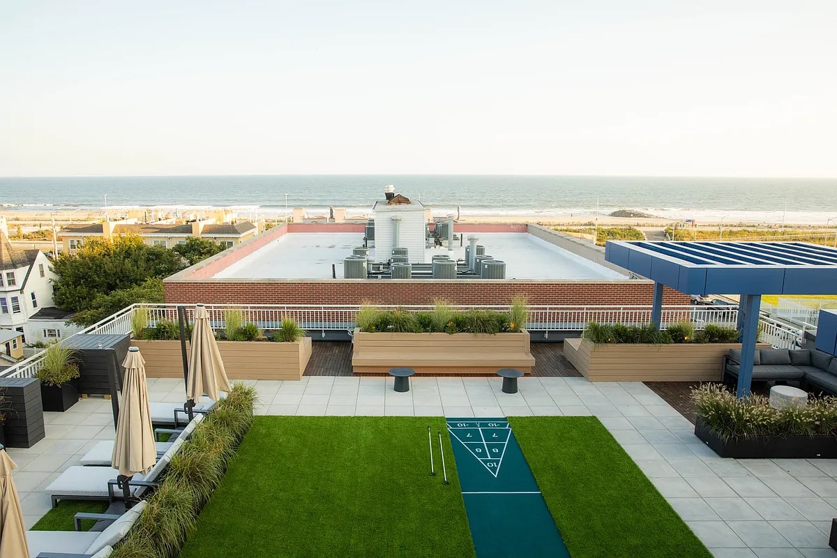 rooftop in Rockaway with beach and ocean views in the background - NYC rentals by the beach