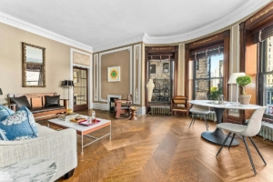 living room with big bay windows in historic Upper West Side co-op