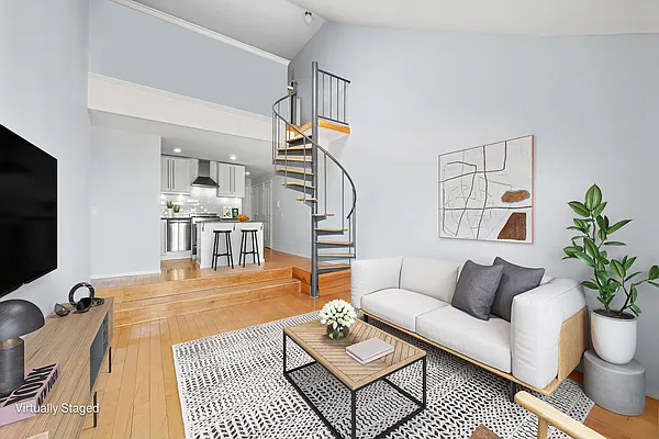 living room and spiral staircase in Greenwich Village homes under $1M