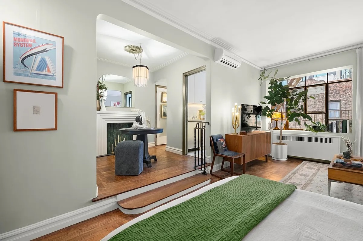 living room and foyer with decorative fireplace in Chelsea studio