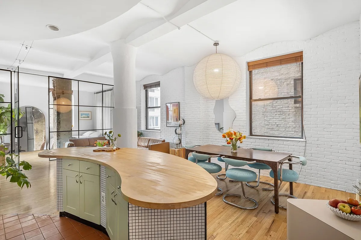 kitchen island and dining room in Gramercy 2-bedroom loft