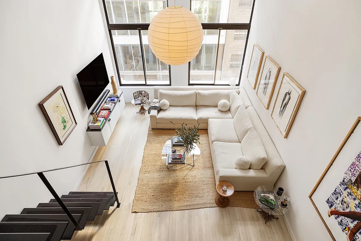 living room in Greenwich Village duplex with staircase from above