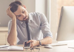 photo of man holding his head