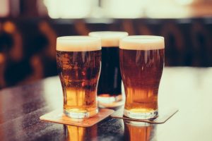 image of beer pints on table.