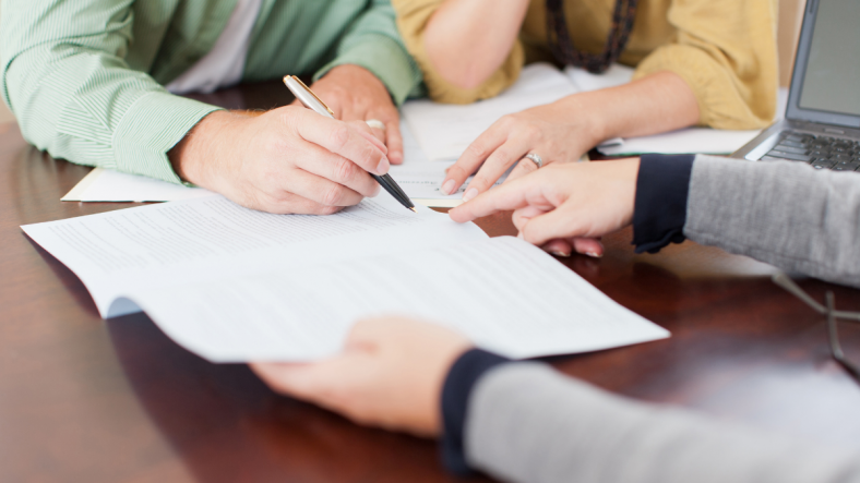 Couple signing contract